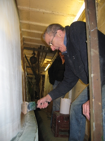 Trevor starts to apply the salmon on the name panel