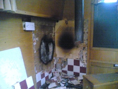 Fire damage behind stove